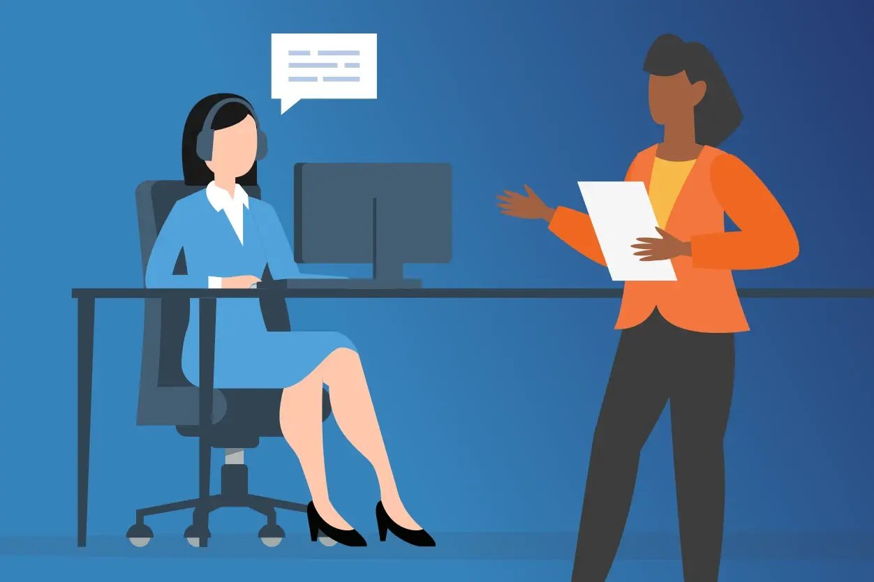 Image of a call center agent being instructed by a coach.